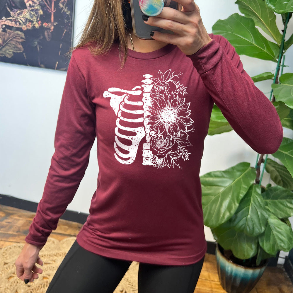 heather cardinal long sleeve shirt with the graphic of a skeletal ribcage, with half of it being made up of flowers