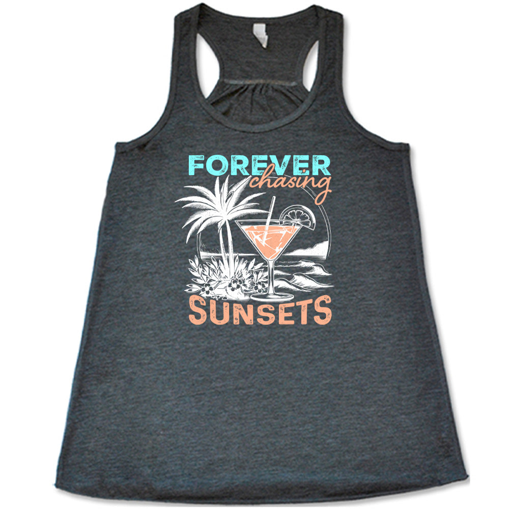 Grey colored flowy tank with a drink on the beach graphic on it that says "Forever Chasing Sunsets"