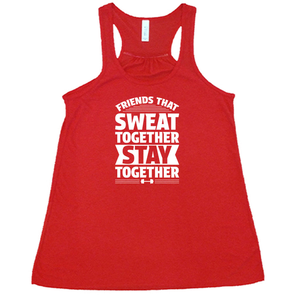 Red colored flowy tank that says "Friends That Sweat Together Stay Together"