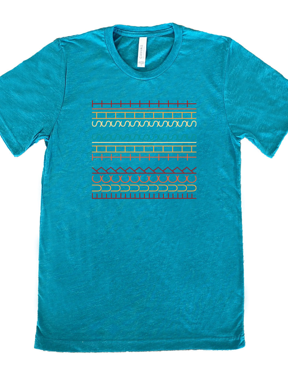 teal unisex tee with the graphic of what appears to be colorful lined shapes, but, when you look at an angle, actually is the three words, 11 times, sayings "fuck this shit"