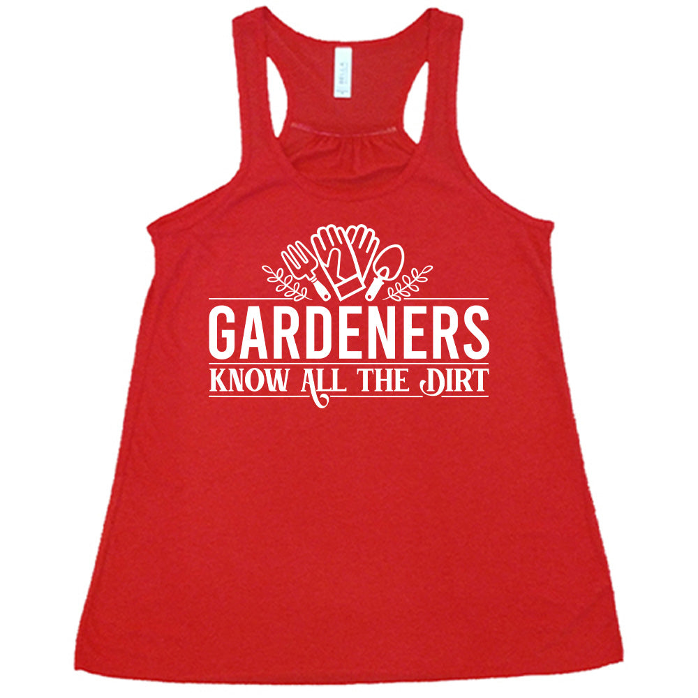 red flowy racerback tank with the words "gardeners know all the dirt" on it, with the graphic of two gloves and two tools above the words