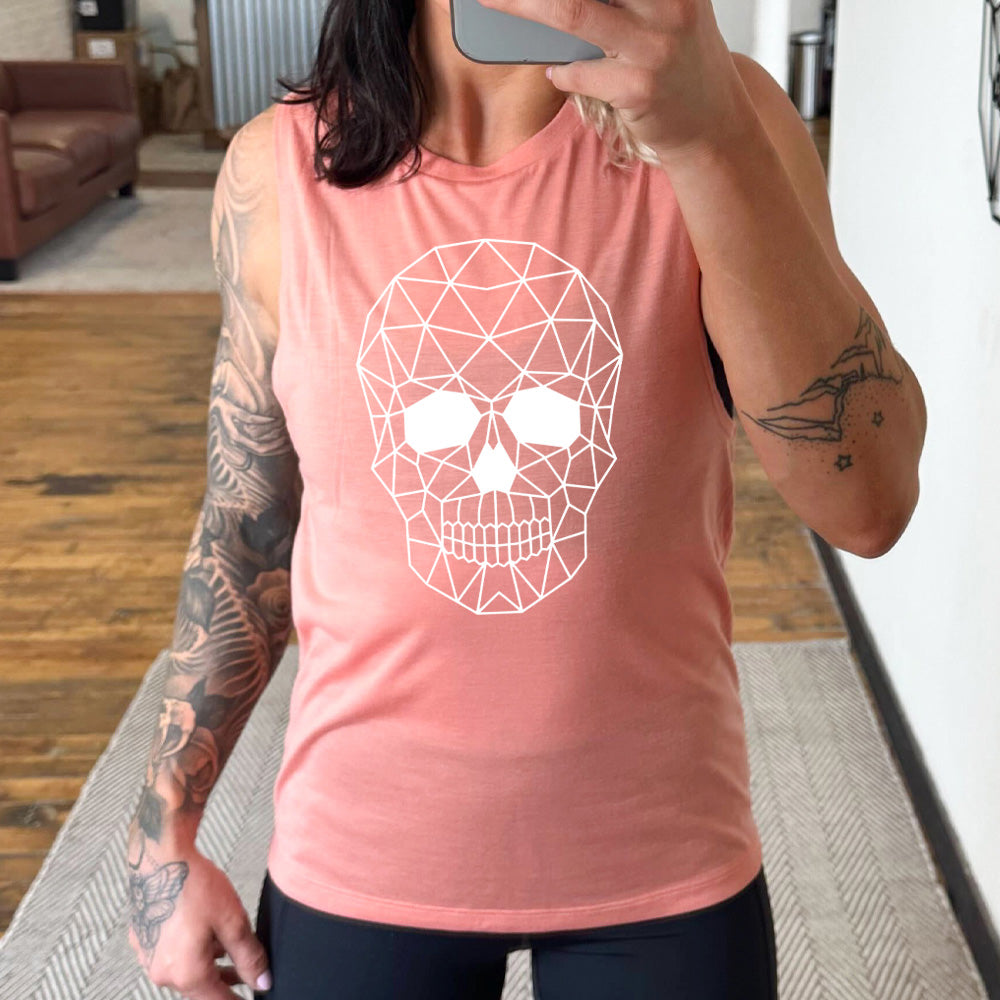 peach muscle tank with the graphic of a geometrically designed skull