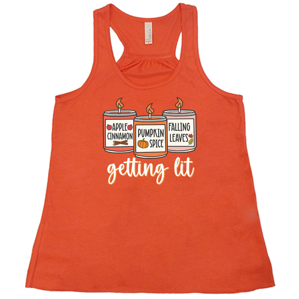 Coral colored flowy tank with fall scented candles graphic on it that says "getting lit"