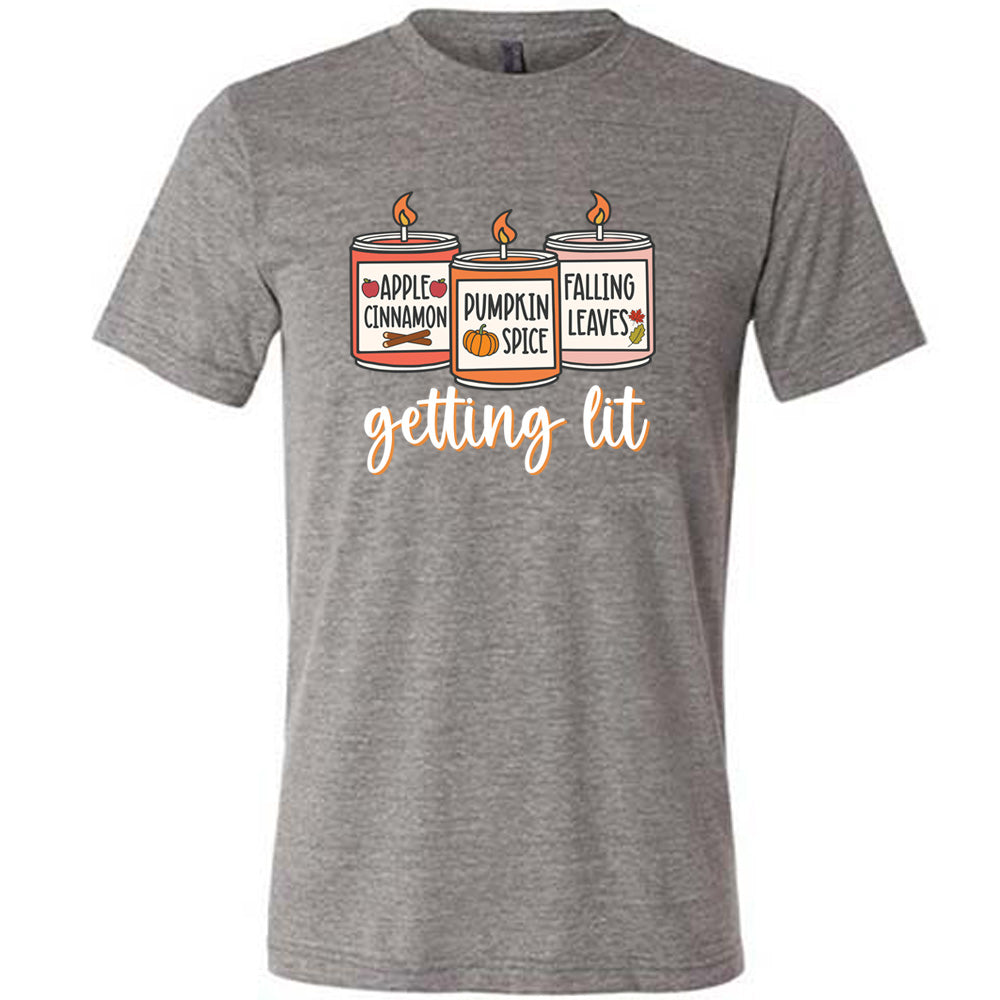 Grey colored shirt with fall scented candles graphic on it that says "getting lit"