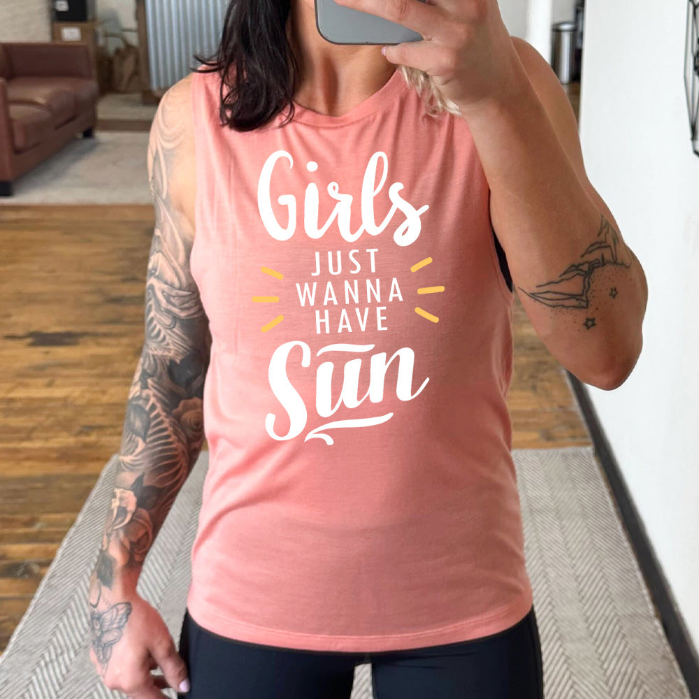 peach muscle tank with a sun ray graphic on it that says "Girls Just Wanna Have Sun"