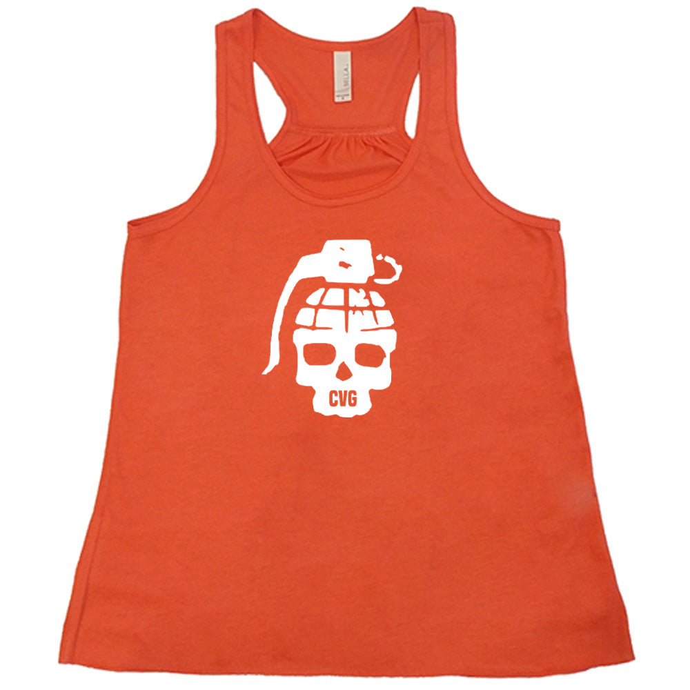 orange shirt with a grenade skull graphic on it
