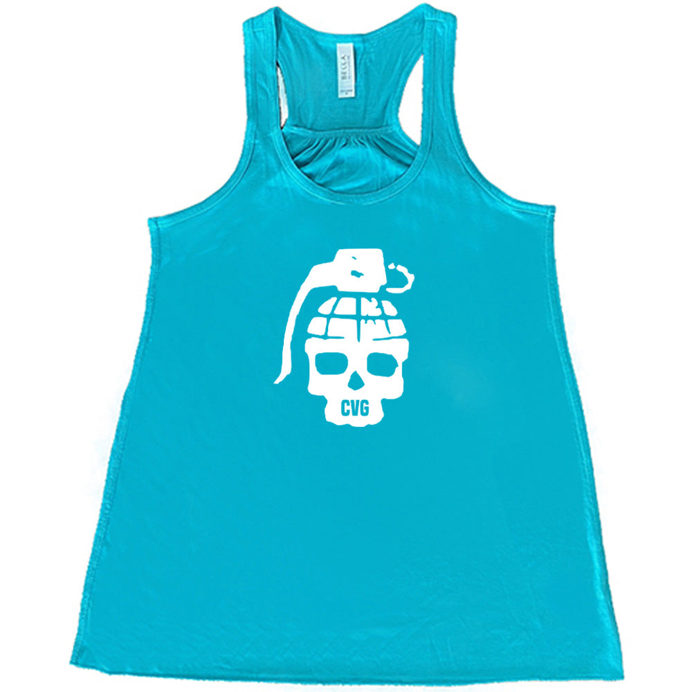 teal shirt with a grenade skull graphic on it