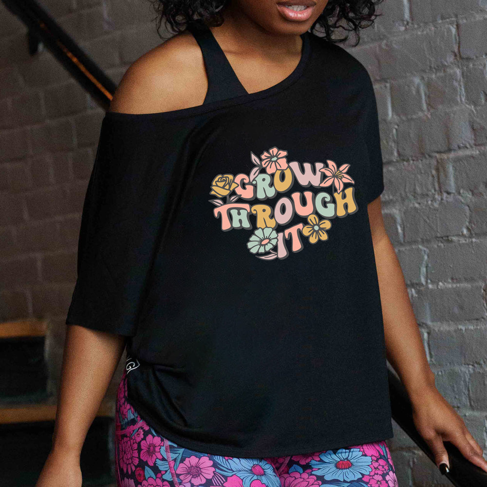 shirt with a flower graphic on it that says "Grow Through It"