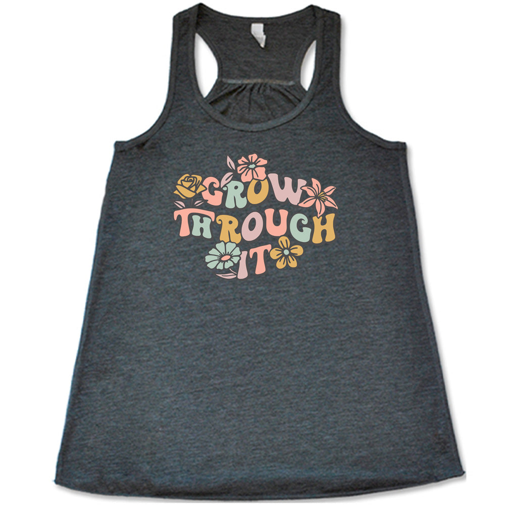 Grey colored flowy tank with a flower graphic on it that says "Grow Through It"