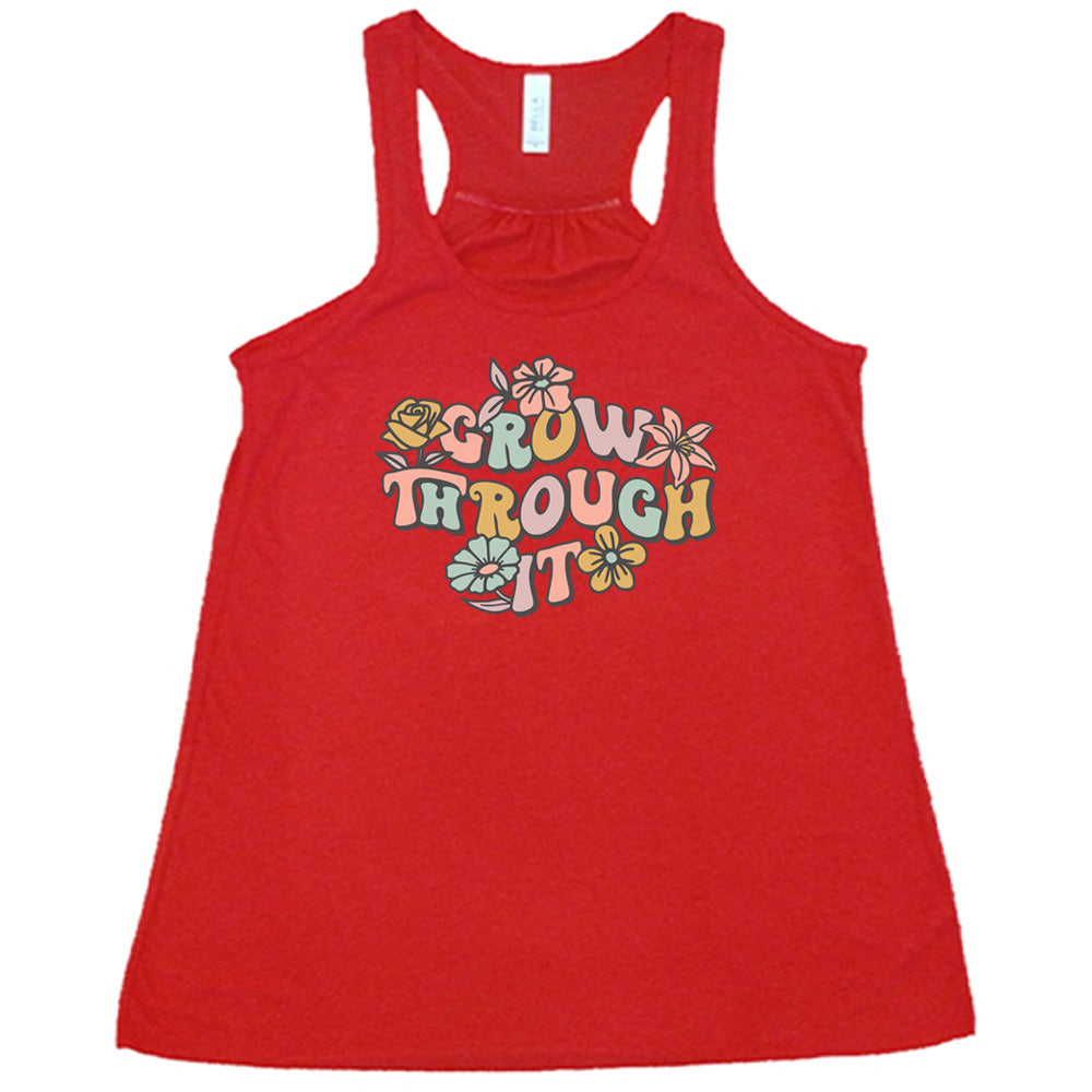Red colored flowy tank with a flower graphic on it that says "Grow Through It"