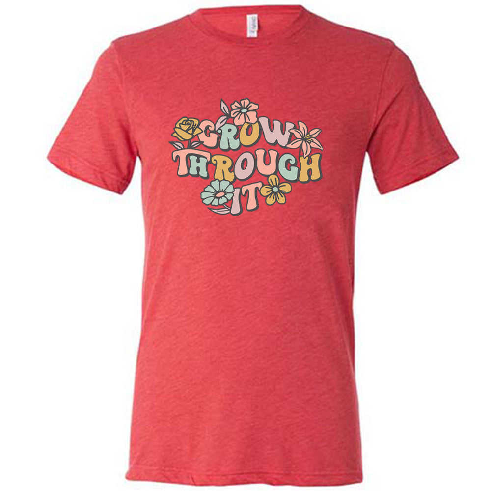 Red colored shirt with a flower graphic on it that says "Grow Through It"