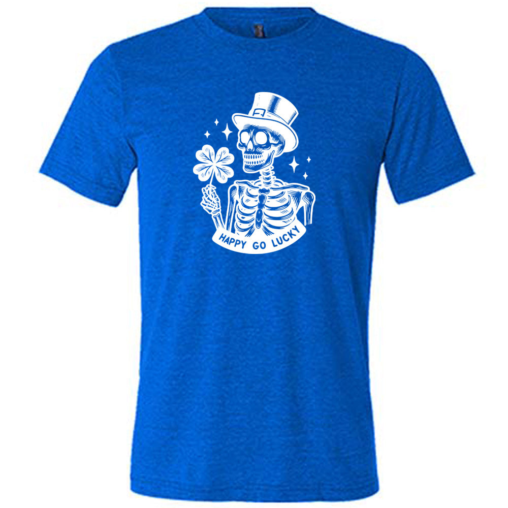 blue shirt with a skeleton graphic and the text "happy go lucky" on it