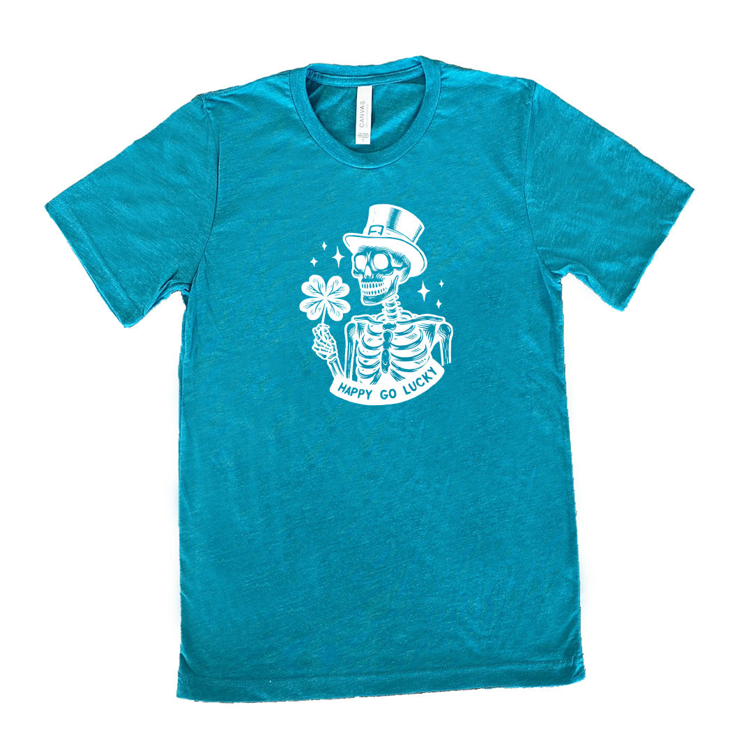 teal shirt with a skeleton graphic and the text "happy go lucky" on it