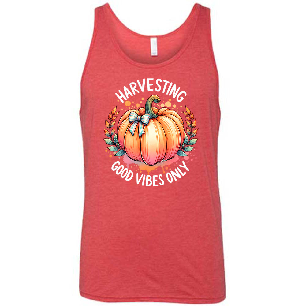 Red colored tank with pumpkin graphic on it that says "Harvesting Good Vibes Only"