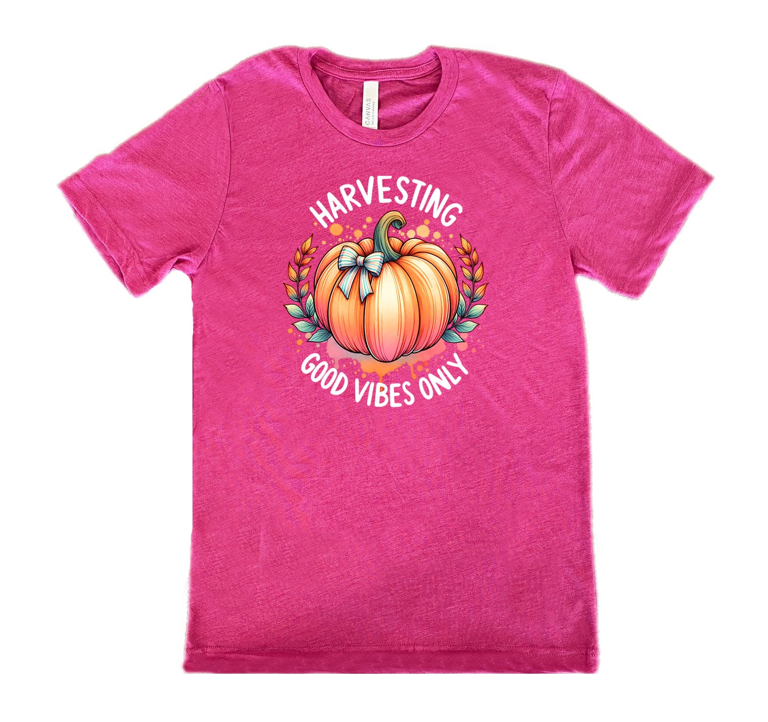 Berry colored shirt with pumpkin graphic on it that says "Harvesting Good Vibes Only"