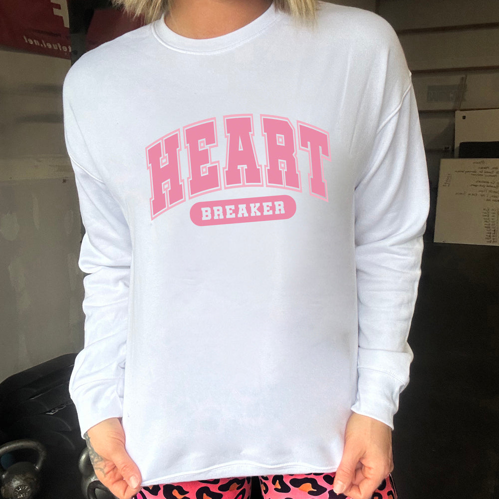 white crewneck with the text "Heart Breaker" on it in pink