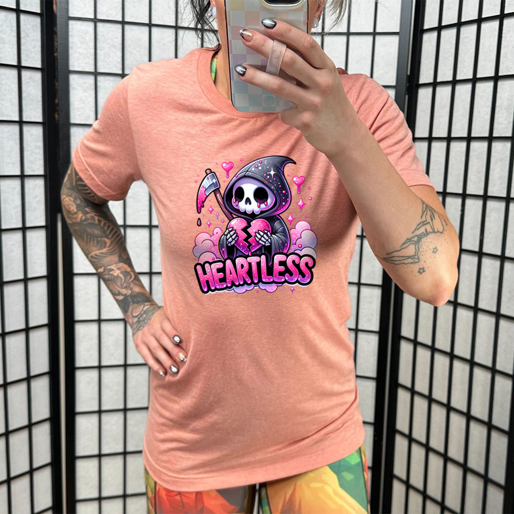 coral shirt with the text "Heartless" on it