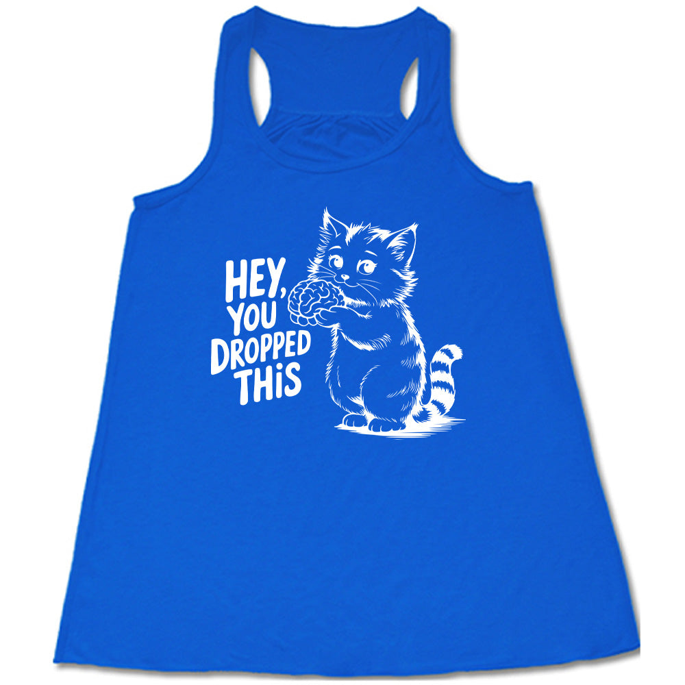 blue flowy tank with the words "Hey, you dropped this" and the graphic of a racoon holding a brain