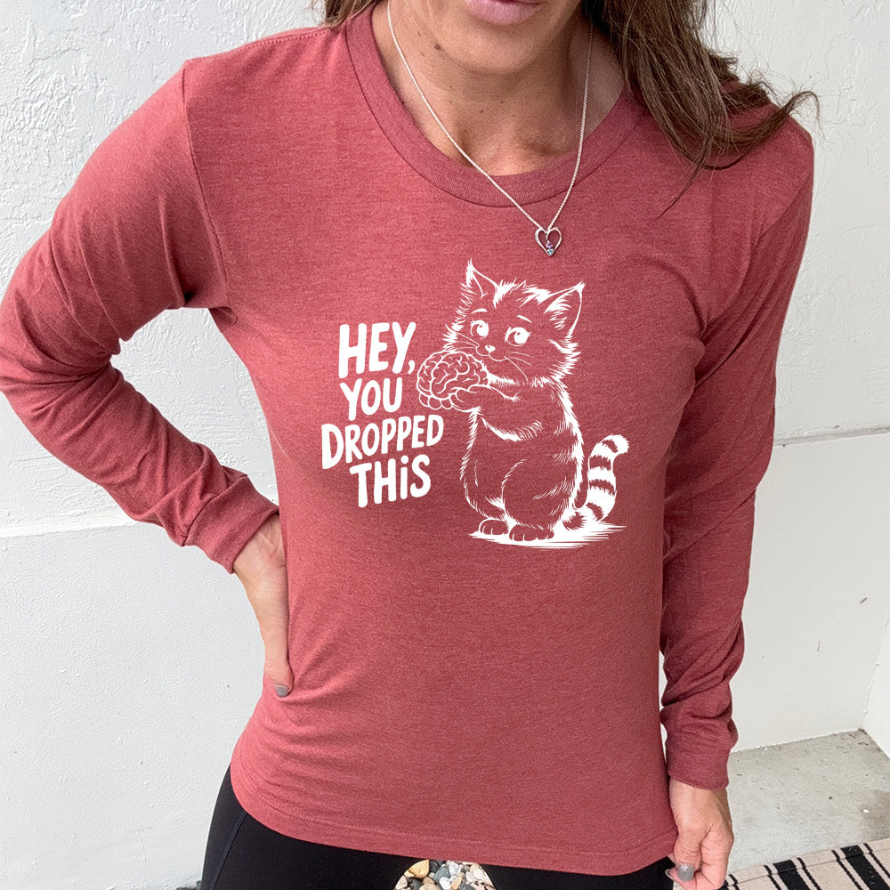 heather clay long sleeve with the words "Hey, you dropped this" and the graphic of a racoon holding a brain