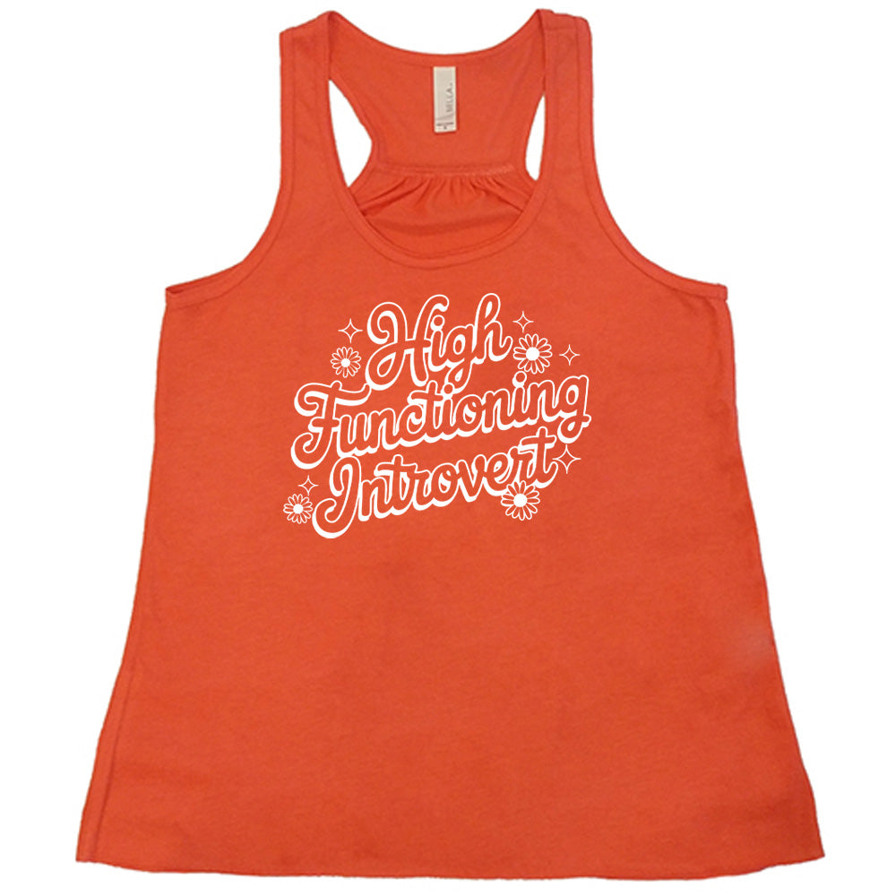 Coral colored flowy tank with a flower graphic on it that says "High Functioning Introvert"