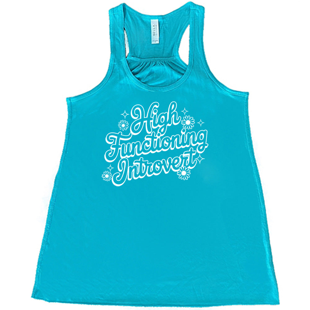 Teal colored flowy tank with a flower graphic on it that says "High Functioning Introvert"