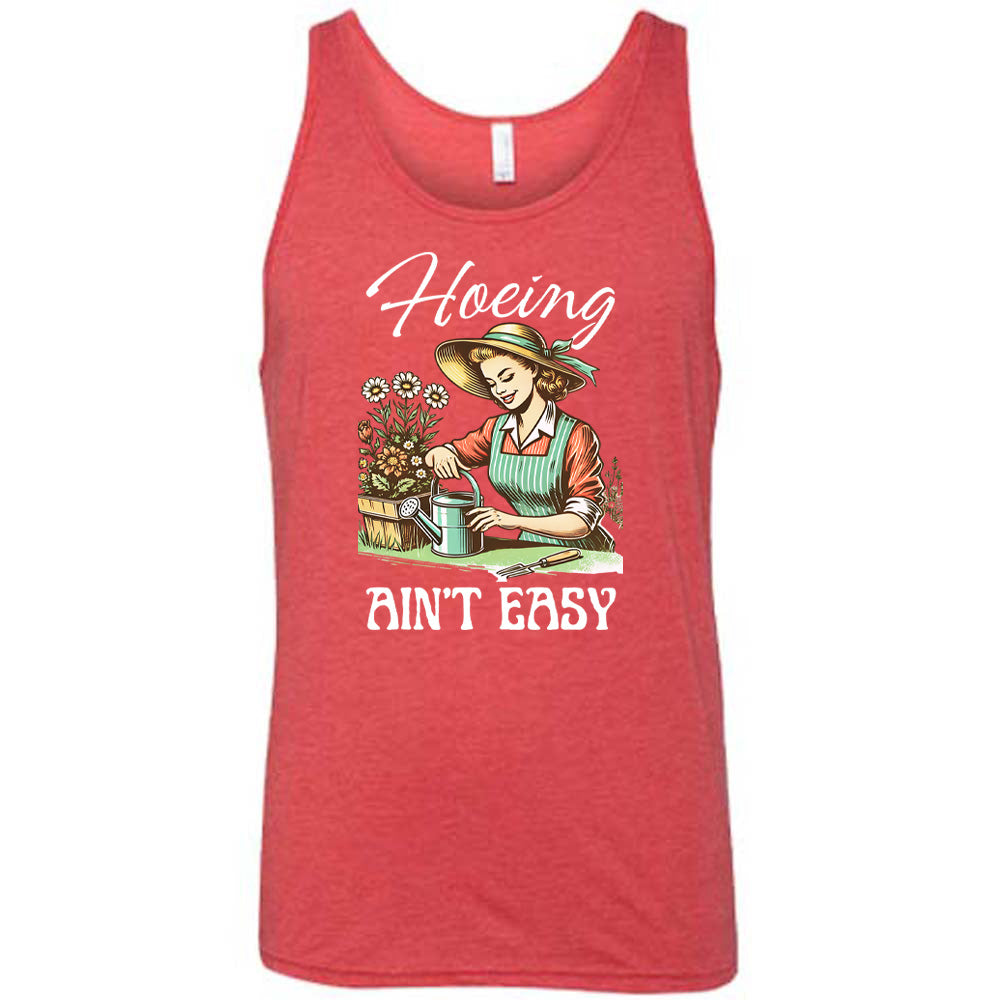 Red colored tank with a woman gardening graphic on it that says "Hoeing Ain't Easy"