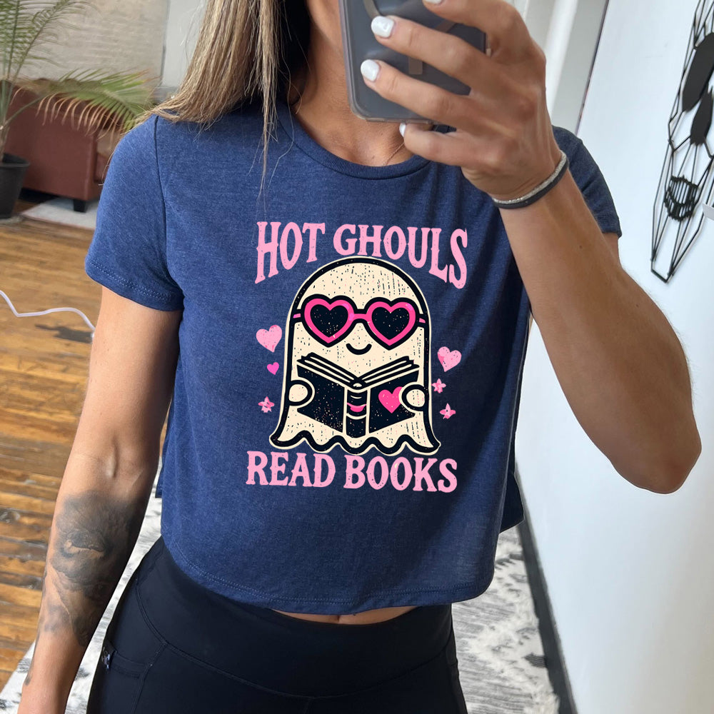 Model wearing navy colored cropped tee with ghost wearing heart-shaped glasses holding a book graphic on it that says "Hot Ghouls Read Books"