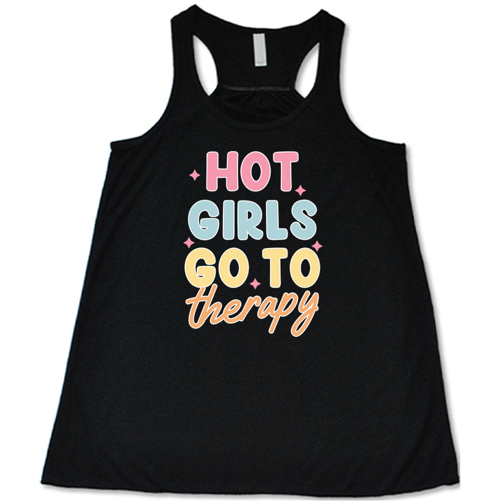 Black colored flowy tank with a sparkle graphic on it that says "Hot Girls Go To Therapy"