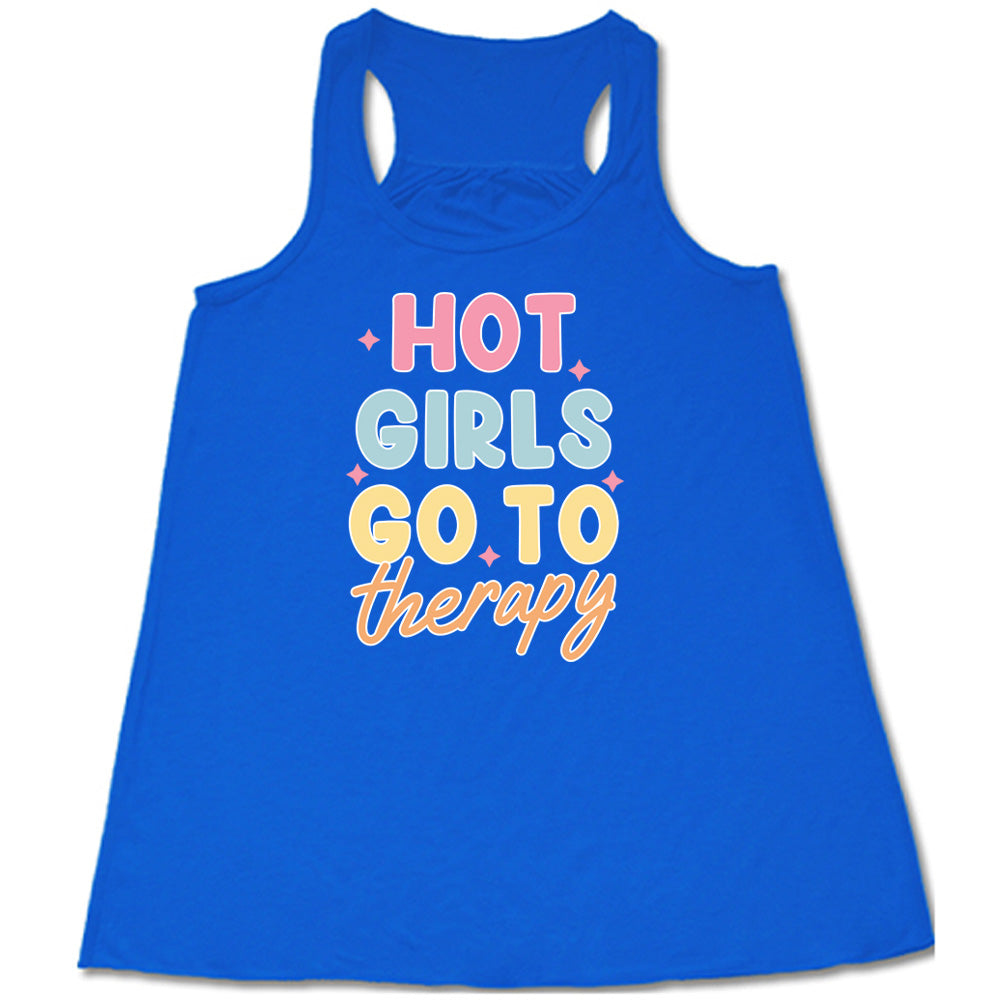 Blue colored flowy tank with a sparkle graphic on it that says "Hot Girls Go To Therapy"