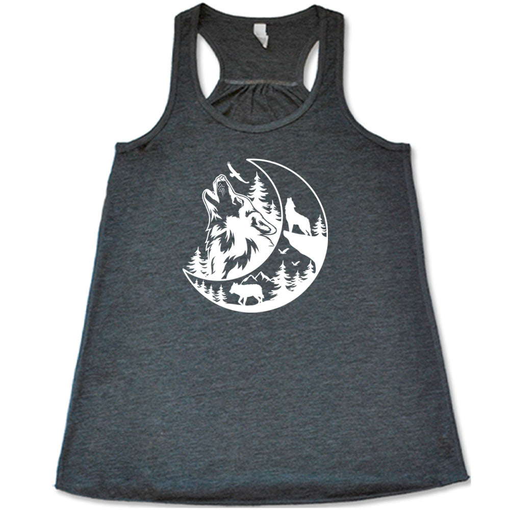 Grey colored flowy tank with a wolf howling at the moon in the forest graphic on it