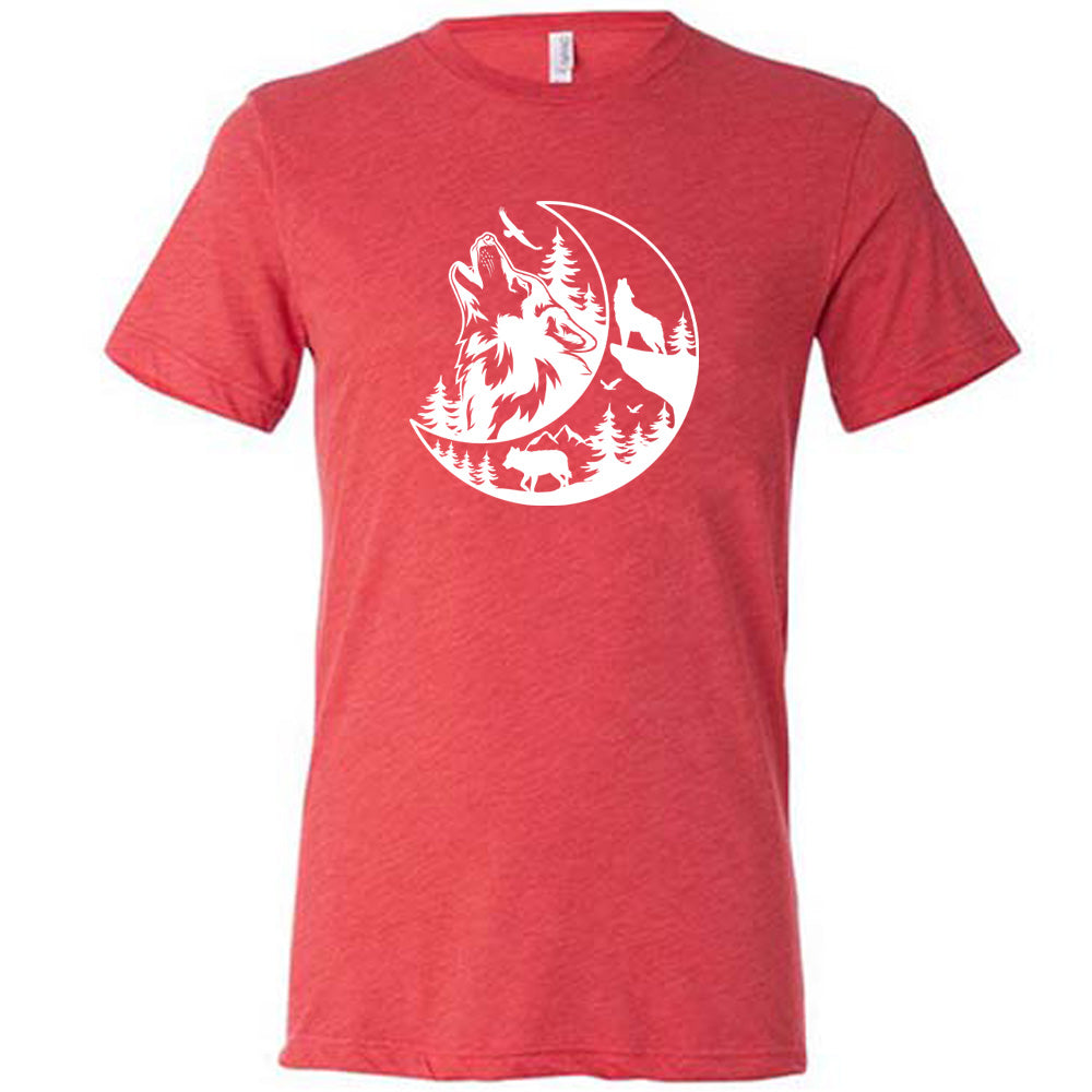 Red colored shirt with a wolf howling at the moon in the forest graphic on it