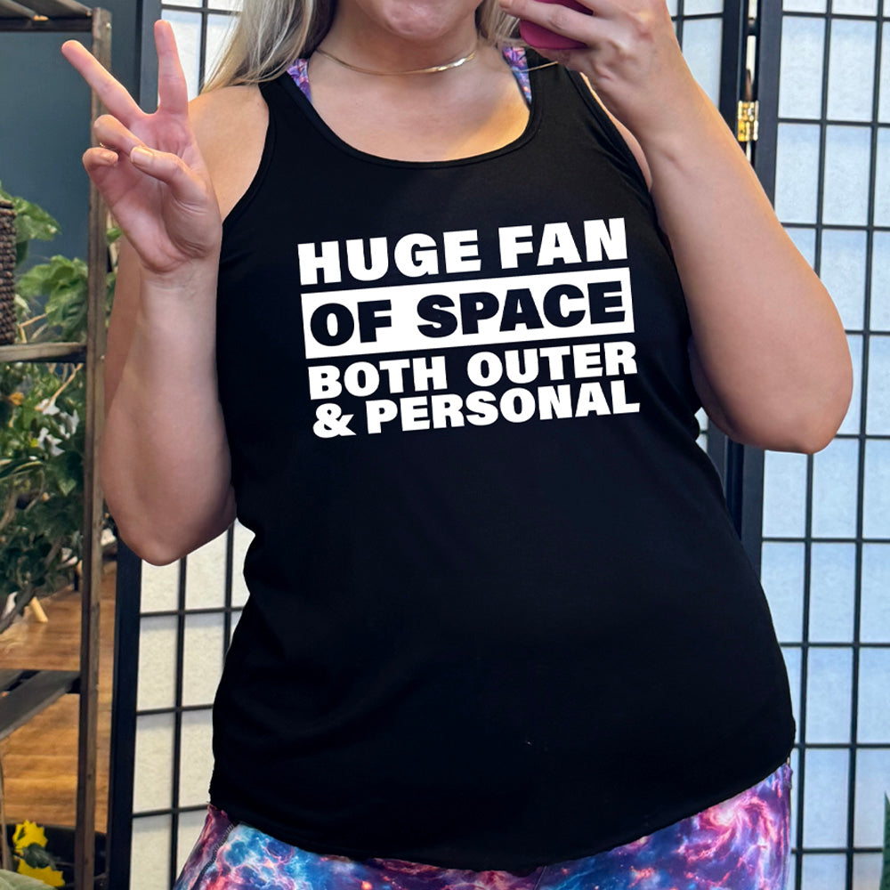 Black colored flowy tank with a graphic on it that says "Huge Fan of Space, Both Outer and Personal"