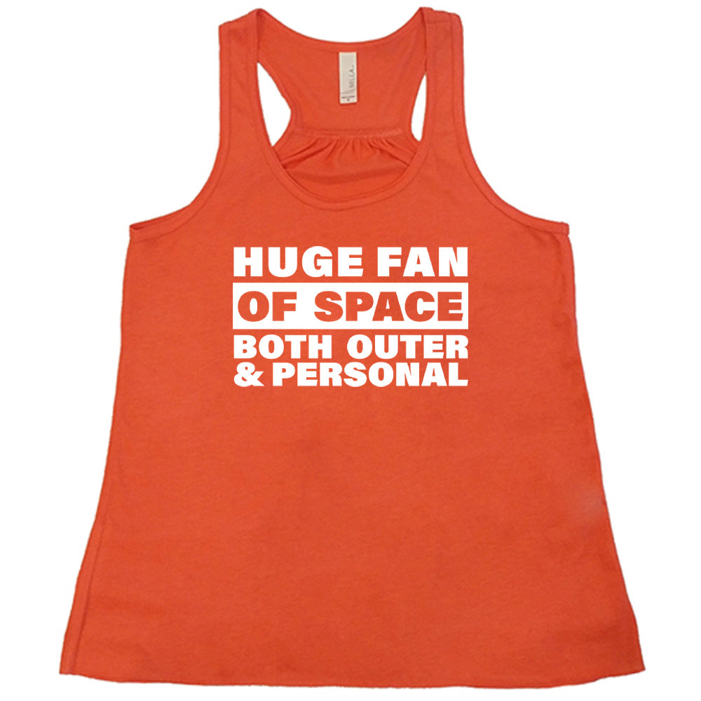 Coral colored flowy tank with a graphic on it that says "Huge Fan of Space, Both Outer and Personal"