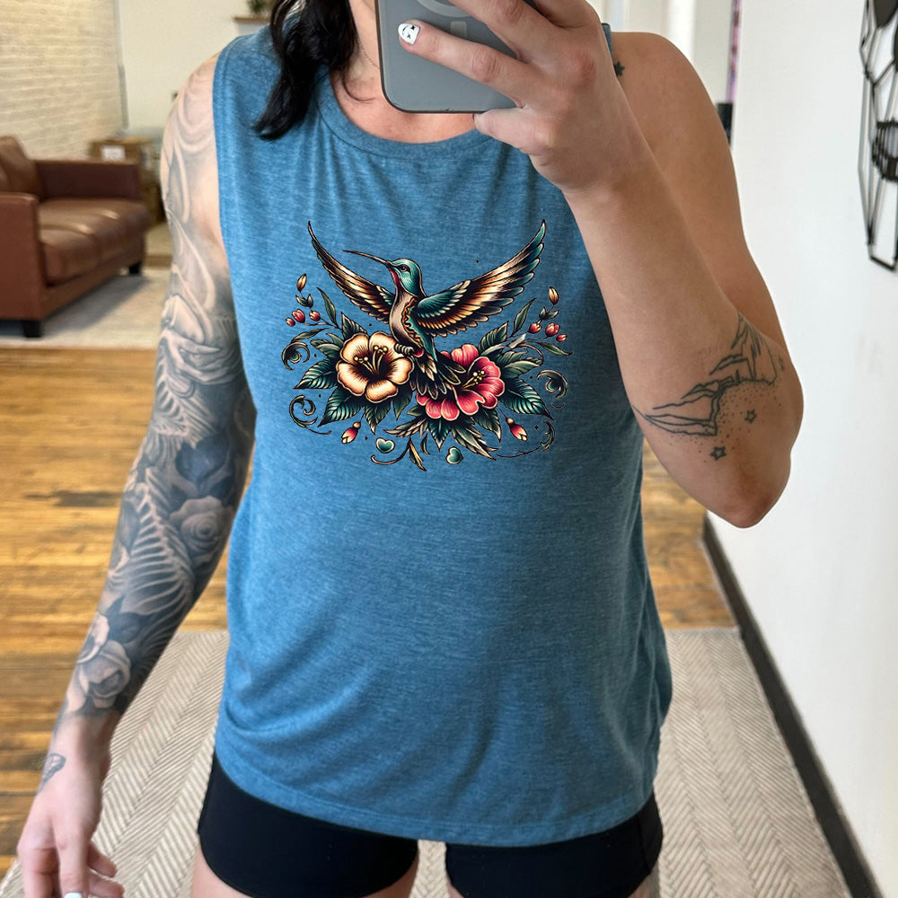 deep teal muscle tank with the graphic of a colorful hummingbird flying, with a colorful flower bouquet