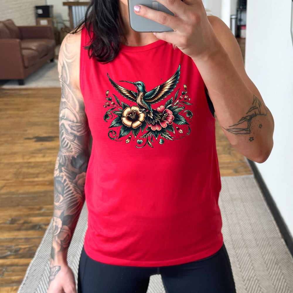 red muscle tank with the graphic of a colorful hummingbird flying, with a colorful flower bouquet