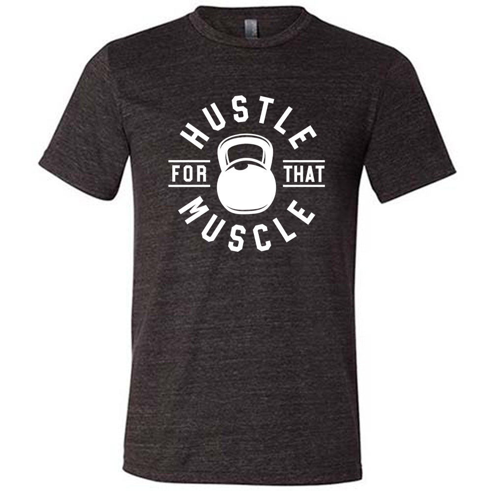 black unisex tee with the words "hustle for that muscle" on it, with a kettlebell image