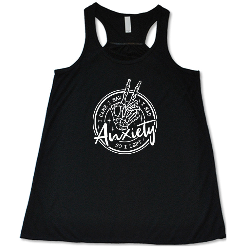 Black colored flowy tank with a skeleton peace sign graphic on it that says "I Came I Saw I Had Anxiety So I Left"