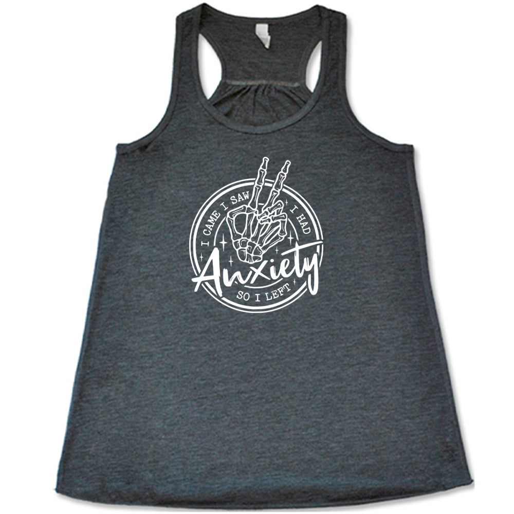 Grey colored flowy tank with a skeleton peace sign graphic on it that says "I Came I Saw I Had Anxiety So I Left"