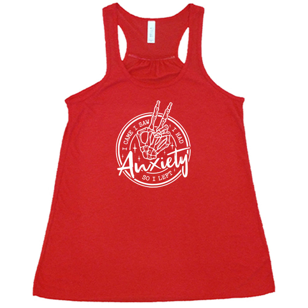 Red colored flowy tank with a skeleton peace sign graphic on it that says "I Came I Saw I Had Anxiety So I Left"