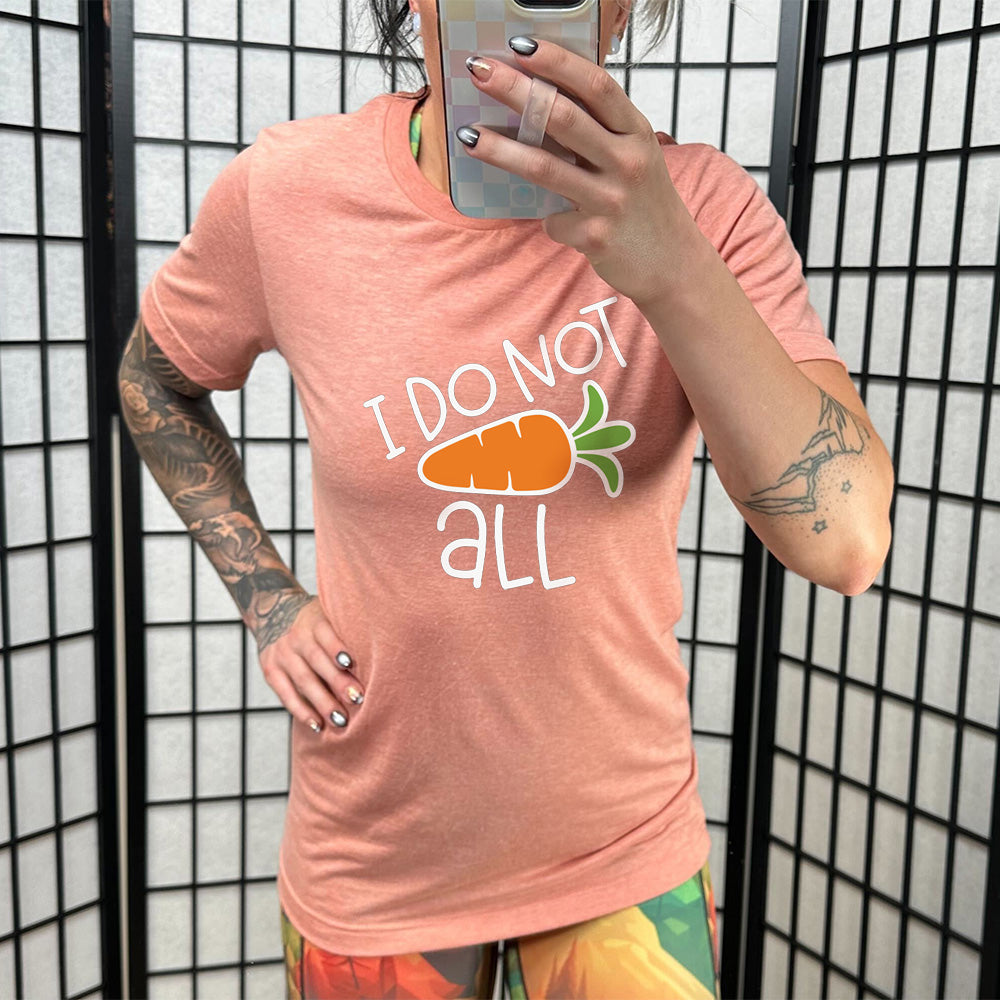 Sunset colored shirt with a carrot graphic on it that says "I Do Not (Carrot) All"