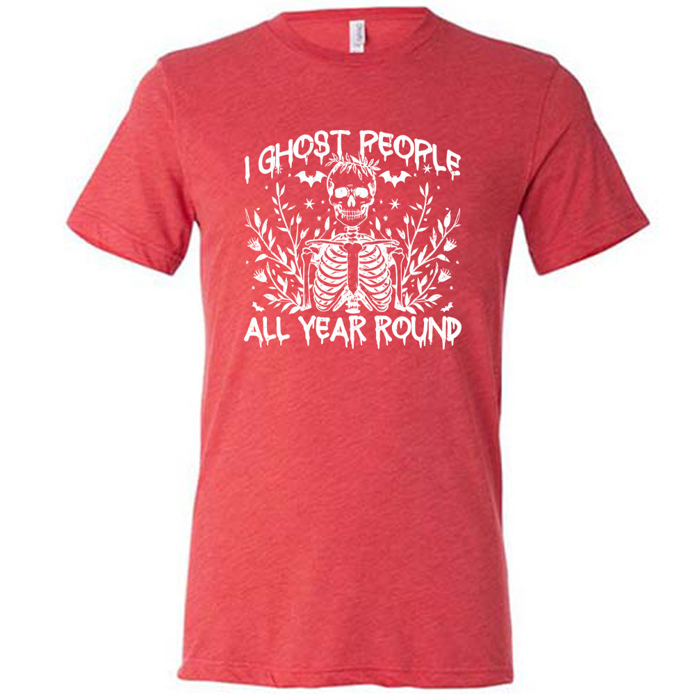 Red colored shirt with skeleton and bats graphic on it that says "I Ghost People All Year Round"