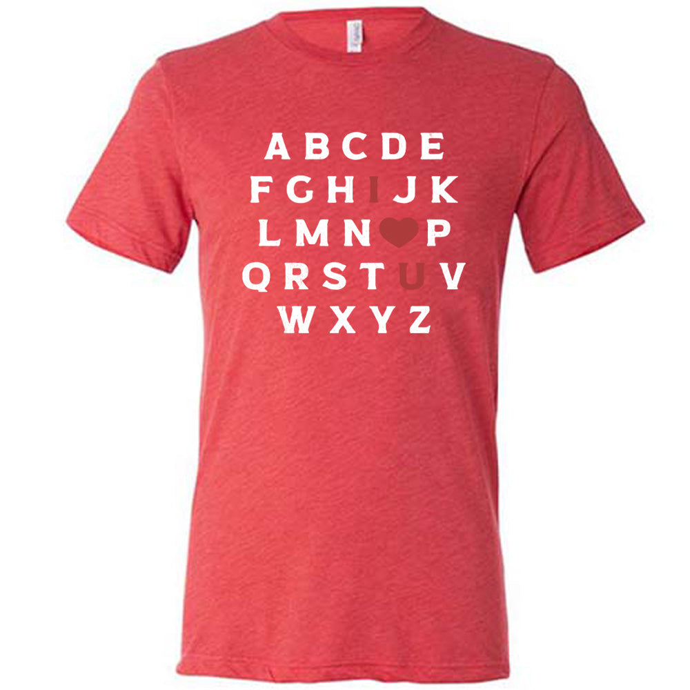 red unisex tee with the alphabet on it in white lettering, but with the "I" in red, the "O" turned into a red heart, and "U" in red