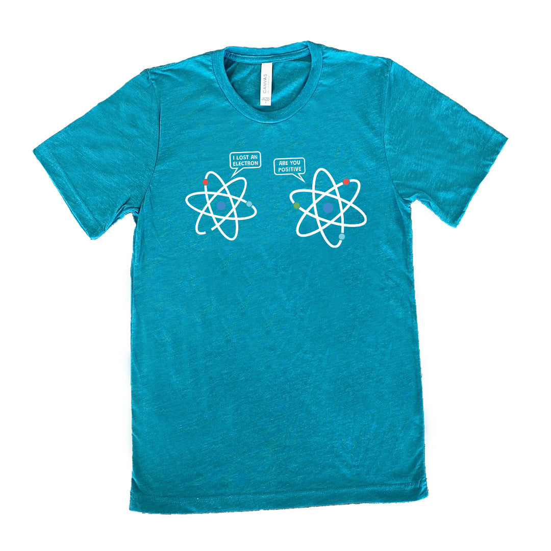 Teal colored shirt with atom graphic on it that says "I Lost An Electron. Are You Positive?"