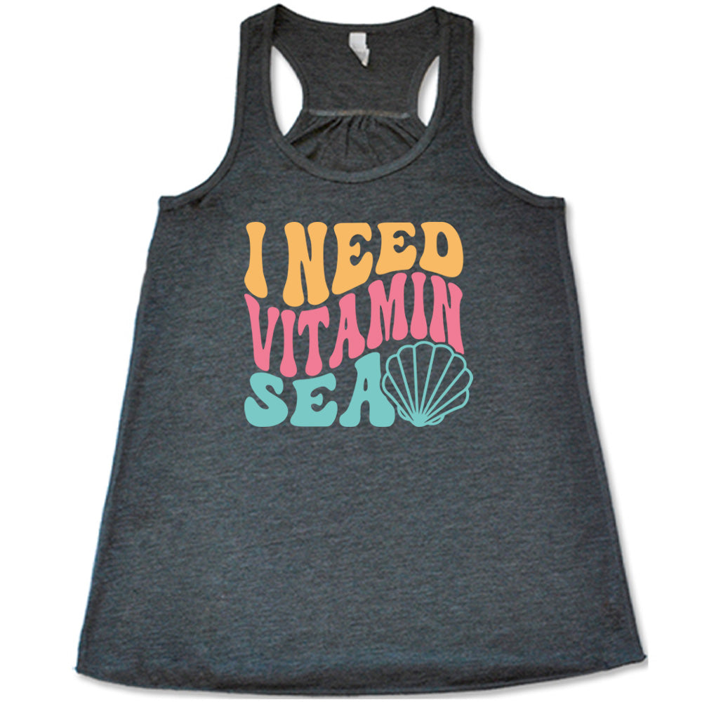 Grey colored flowy tank with a shell graphic on it that says "I Need Vitamin Sea"