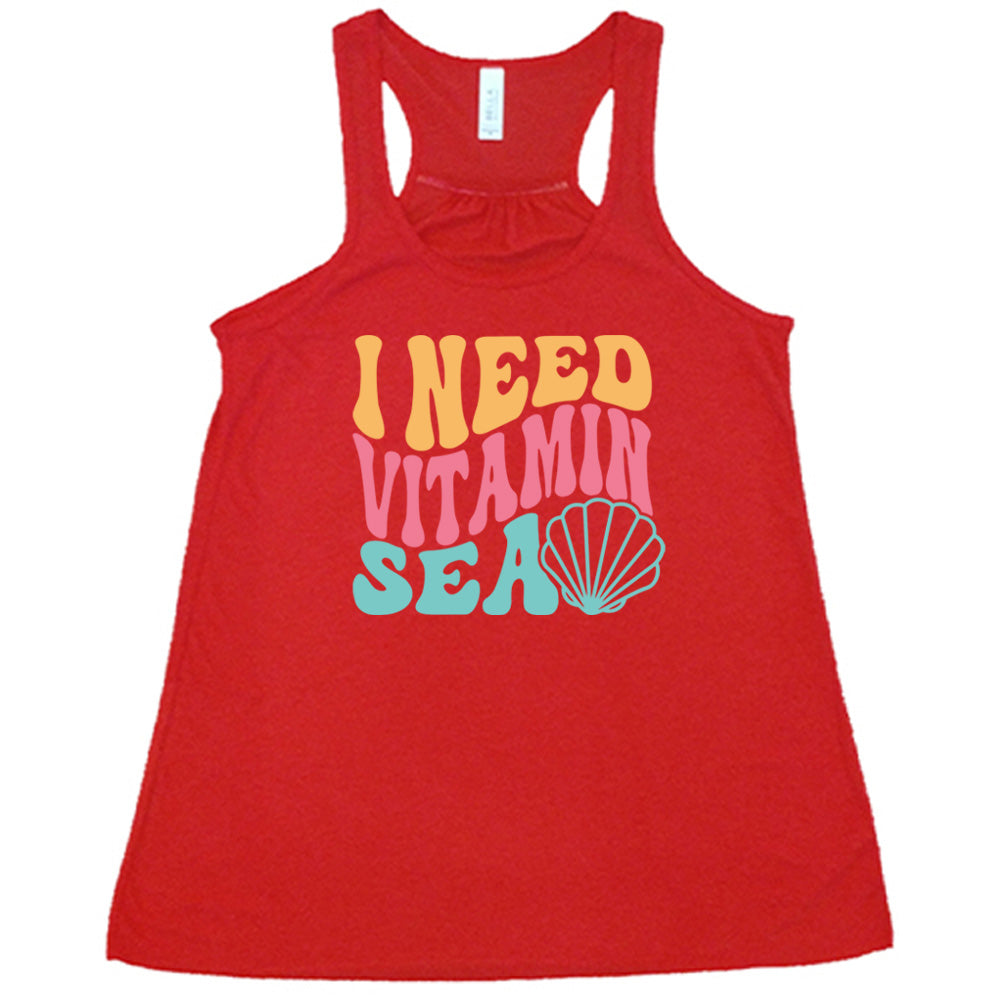 Red colored flowy tank with a shell graphic on it that says "I Need Vitamin Sea"