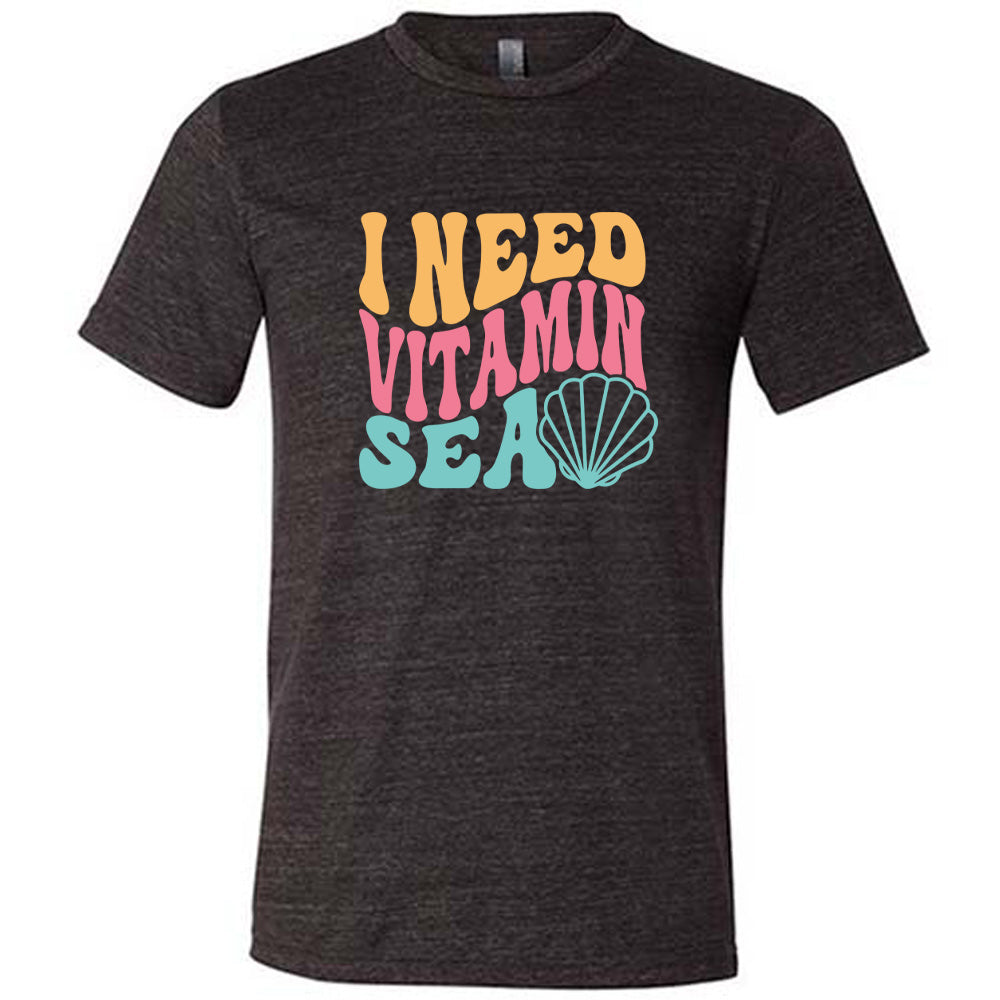 Black colored shirt with a shell graphic on it that says "I Need Vitamin Sea"