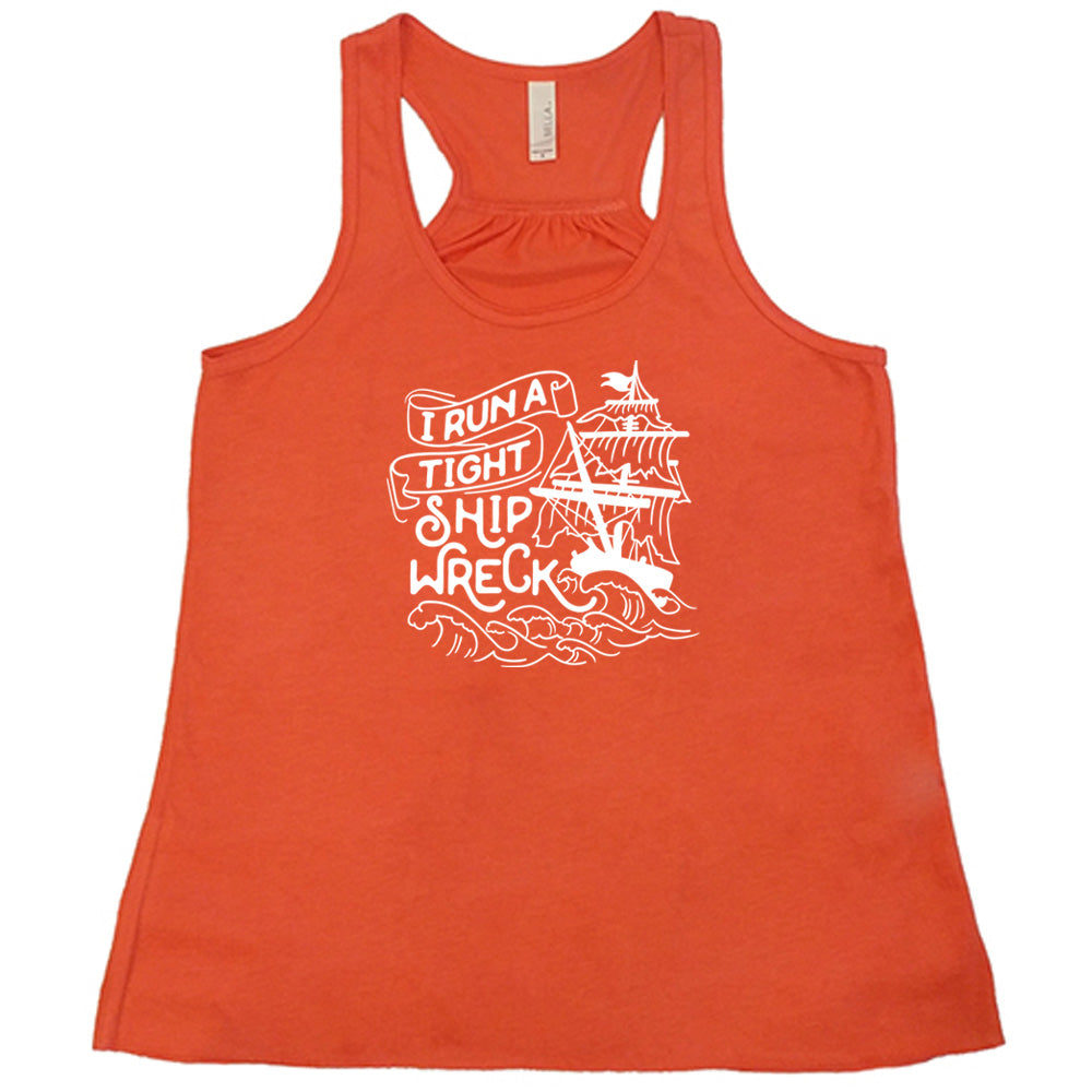 Coral colored flowy tank with a sea ship graphic on it that says "I Run a Tight Shipwreck"