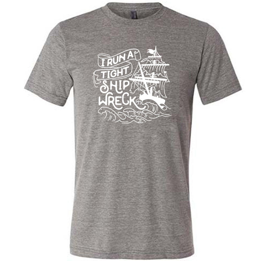 Grey colored shirt with a sea ship graphic on it that says "I Run a Tight Shipwreck"