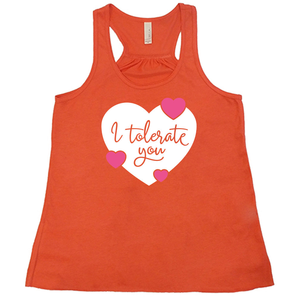 coral flowy tank with the words "I tolerate you" in coral lettering on it, within a white heart graphic that has three small pink hearts overlapping on its edges