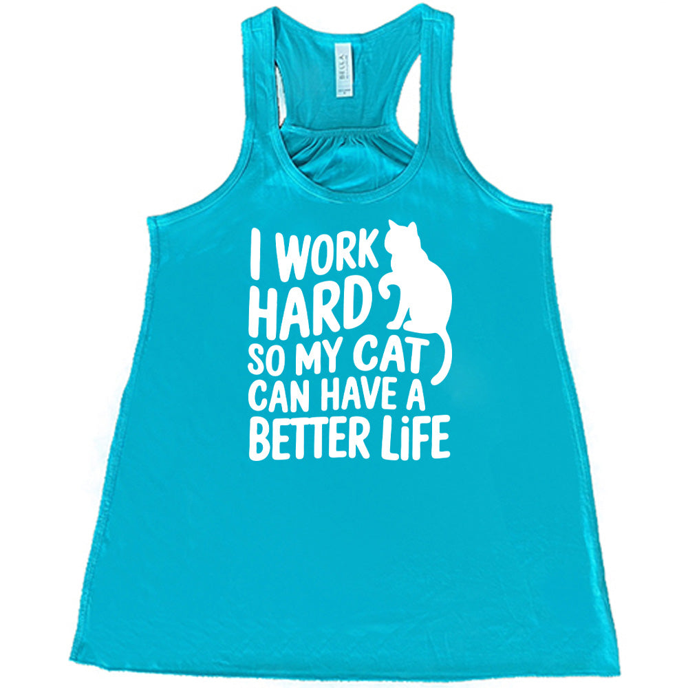 Teal colored flowy tank with cat silhouette graphic on it that says "I Work Hard So My Cat Can Have A Better Life"